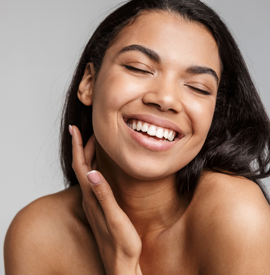 happy woman skincare routine