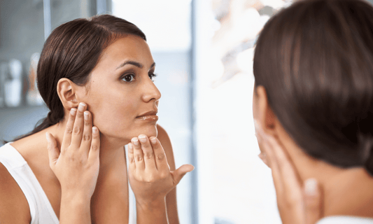 Woman Looking at Skin