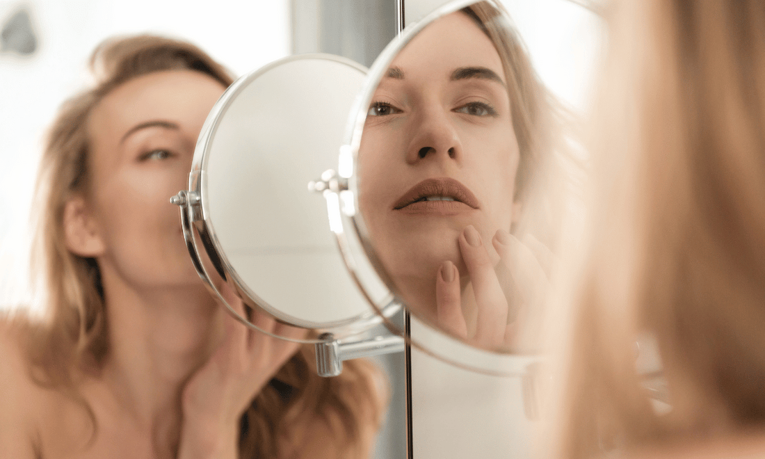 Woman Looking at Parched Skin