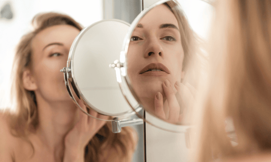 Woman Looking at Parched Skin