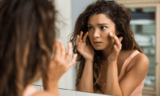 Woman Looking at Tight Skin Under Eye