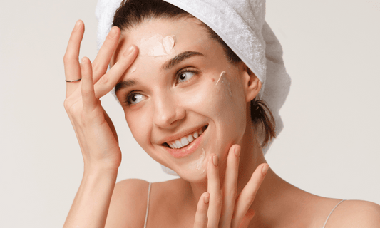 Woman Putting Hydrating Cream on Skin